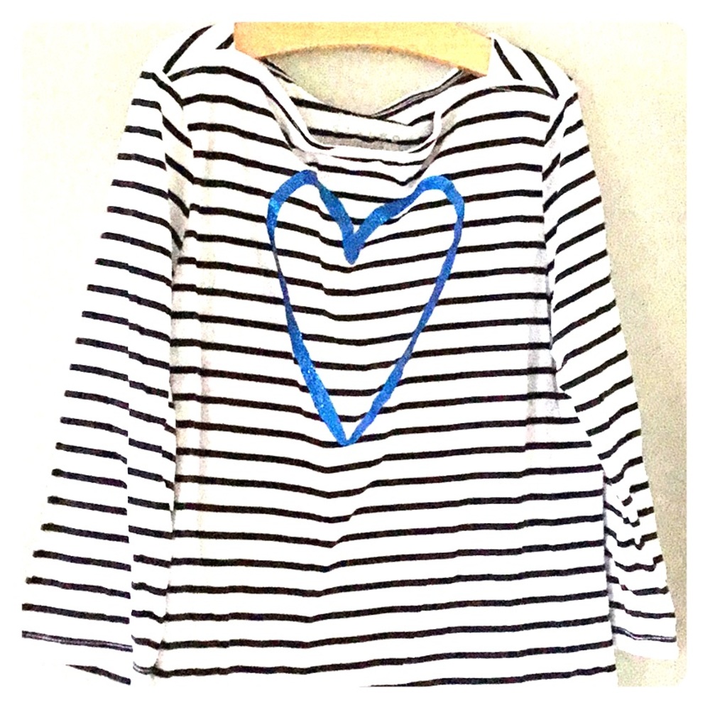 Girls three-quarter inch long sleeve shirt.